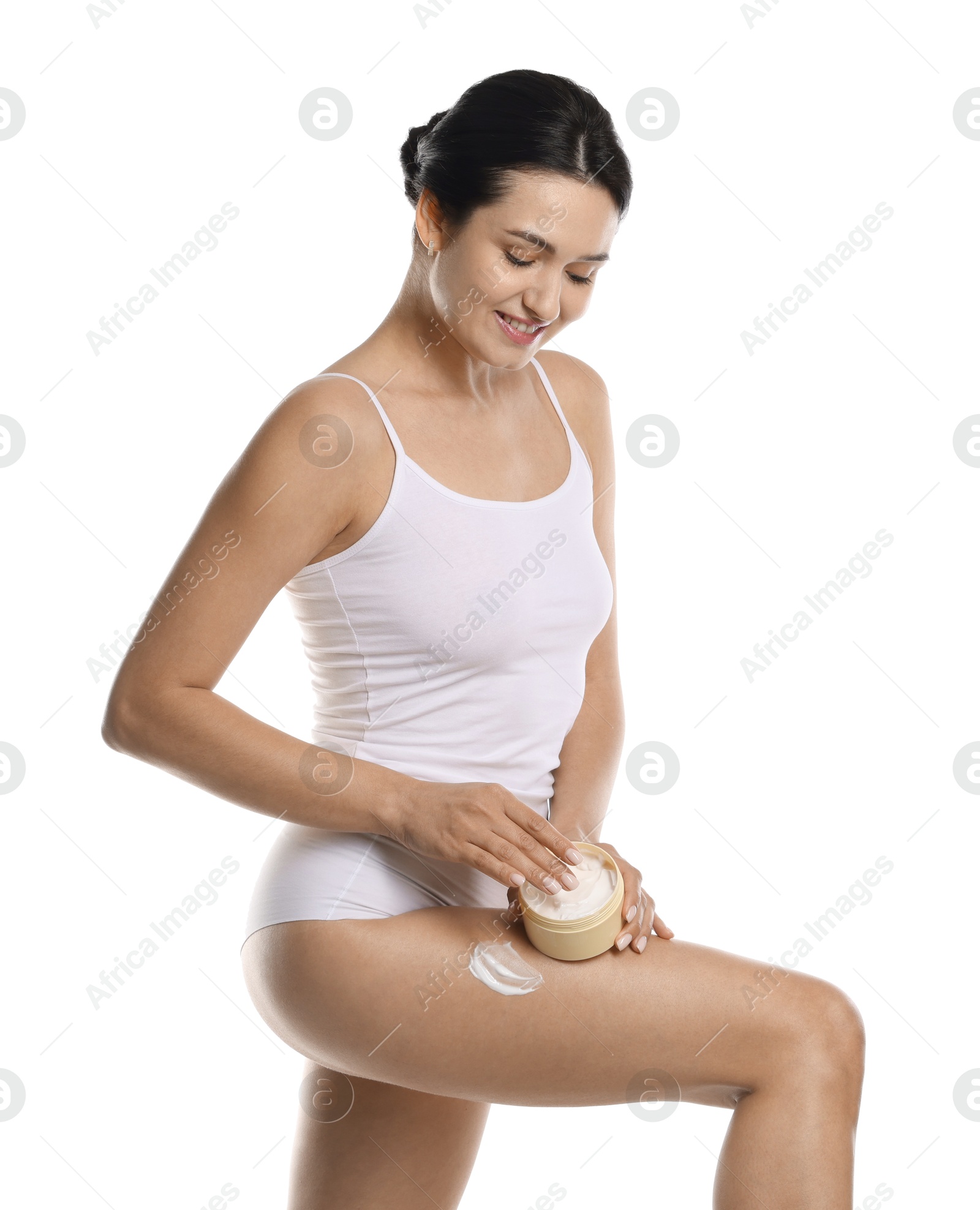 Photo of Woman applying anti cellulite cream on white background