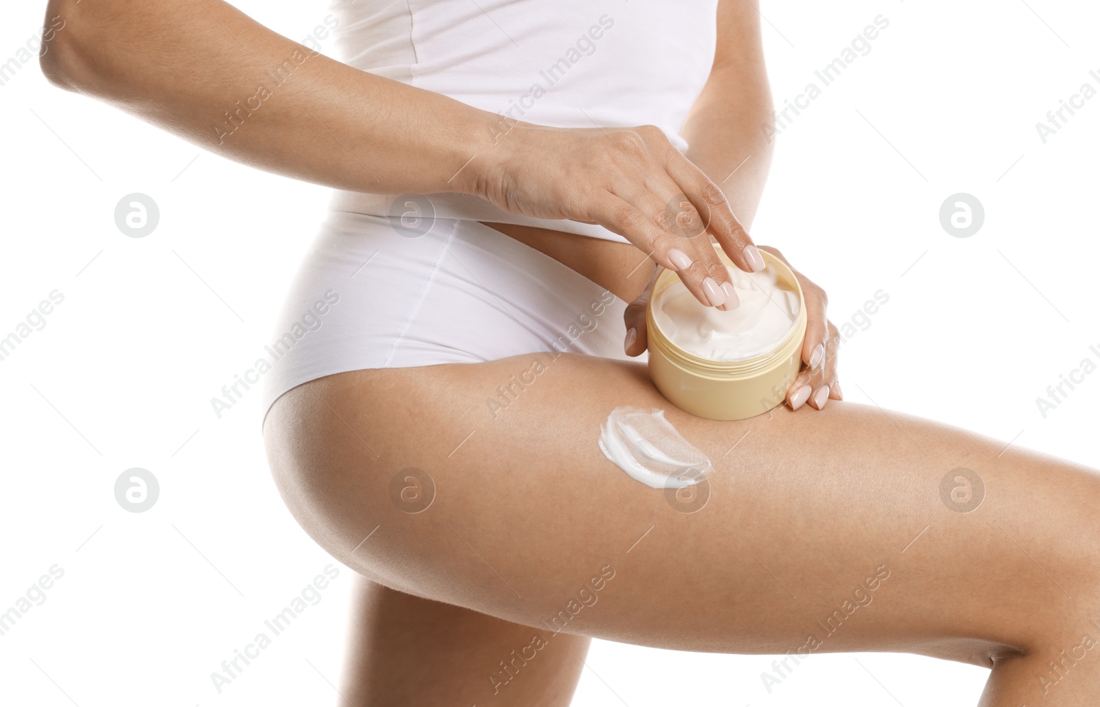 Photo of Woman applying anti cellulite cream on white background, closeup