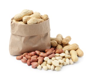Photo of Fresh unpeeled peanuts in paper bag and peeled ones isolated on white