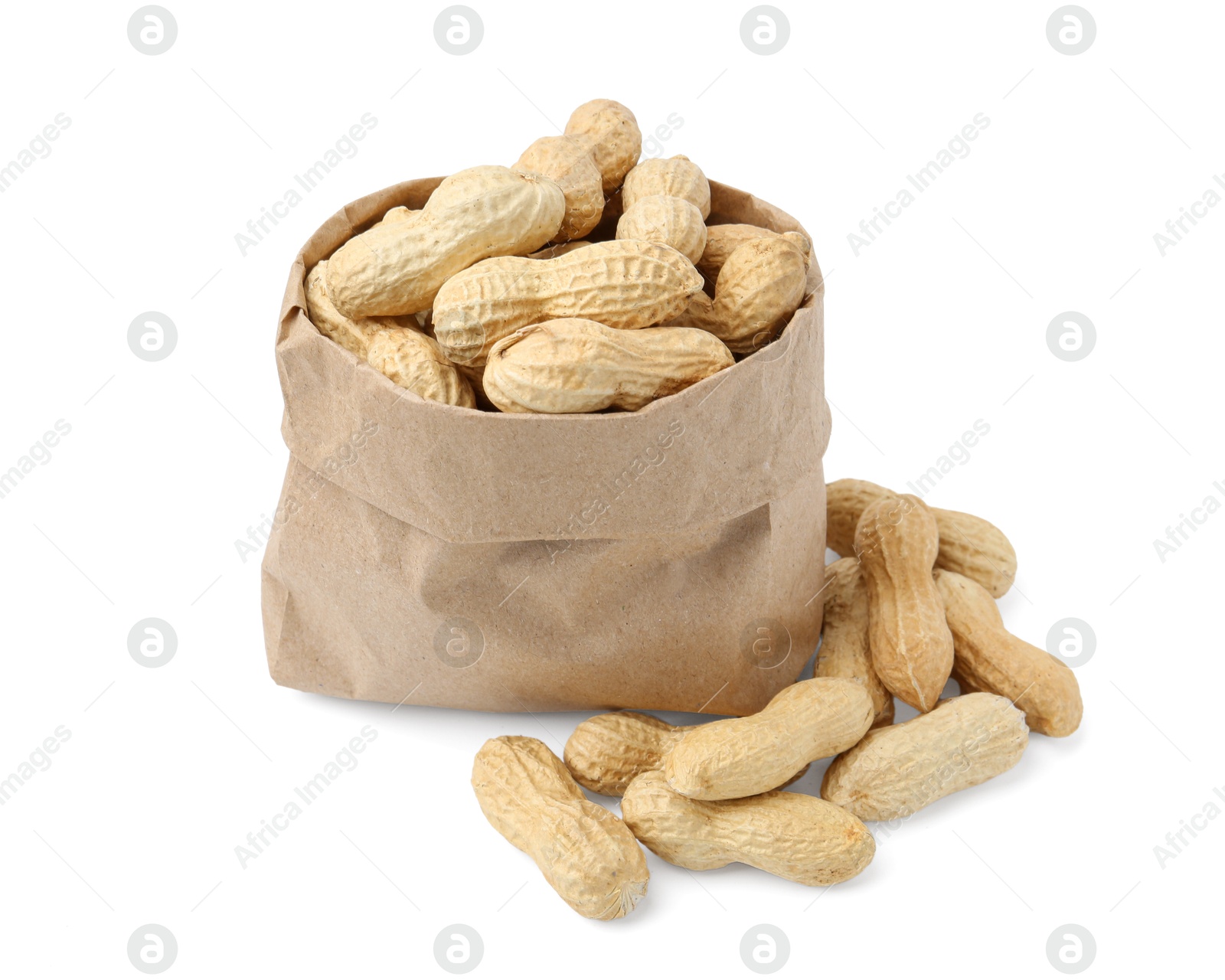 Unpeeled peanuts and paper bag isolated on white Photo of Unpeeled peanuts and paper bag isolated on white