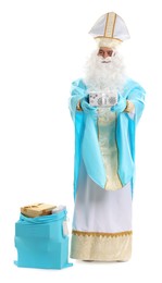 Photo of Saint Nicholas with bag of Christmas gifts on white background