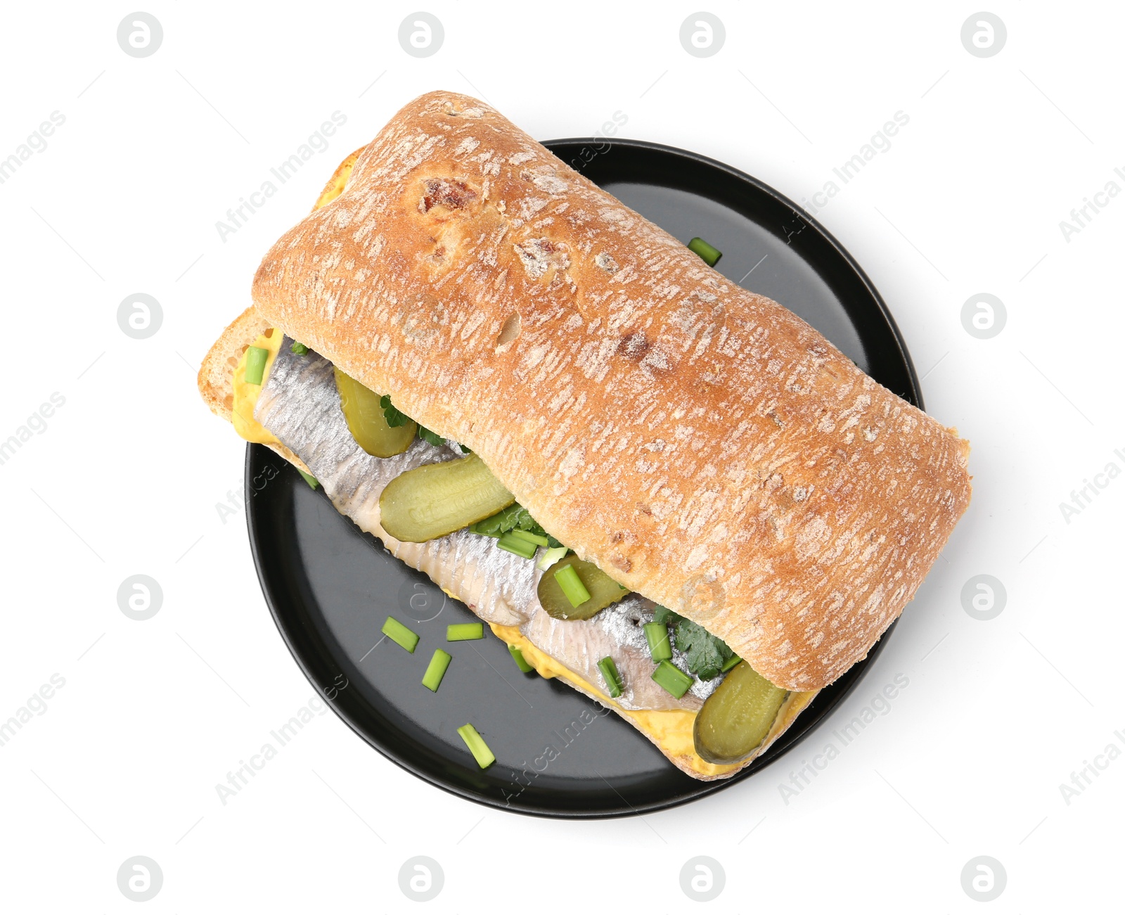 Photo of Tasty sandwich with herring, pickles, green onions and parsley on white background, top view