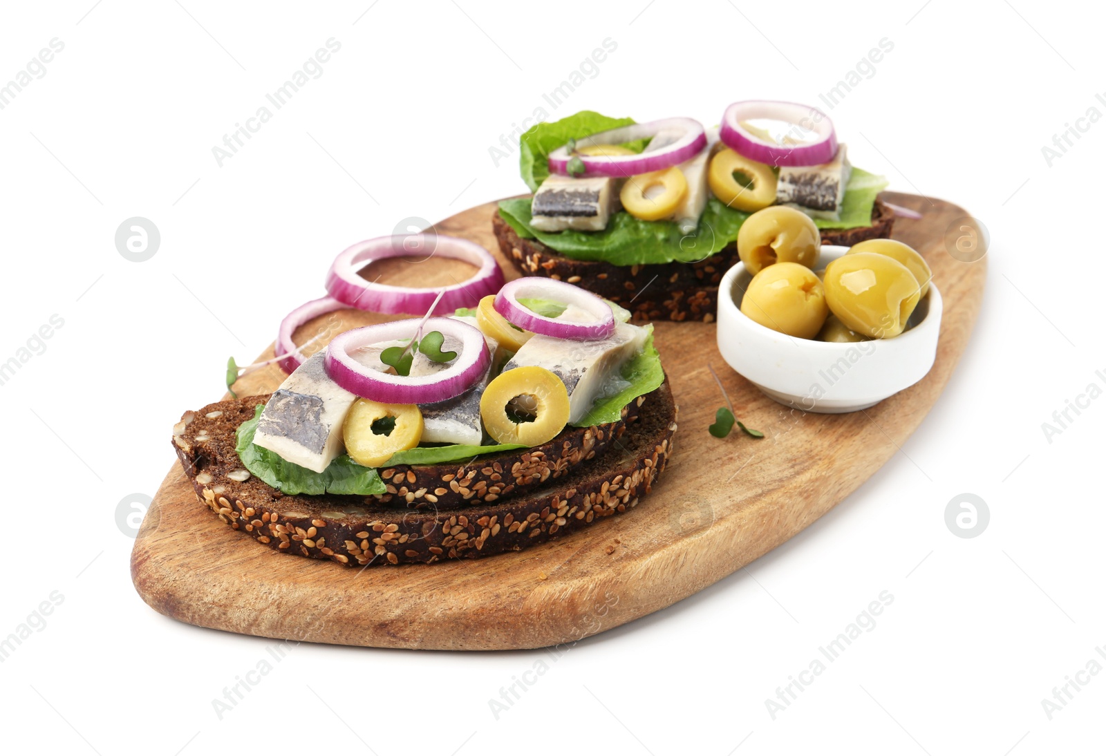 Photo of Tasty sandwiches with herring, onions, lettuce and olives isolated on white