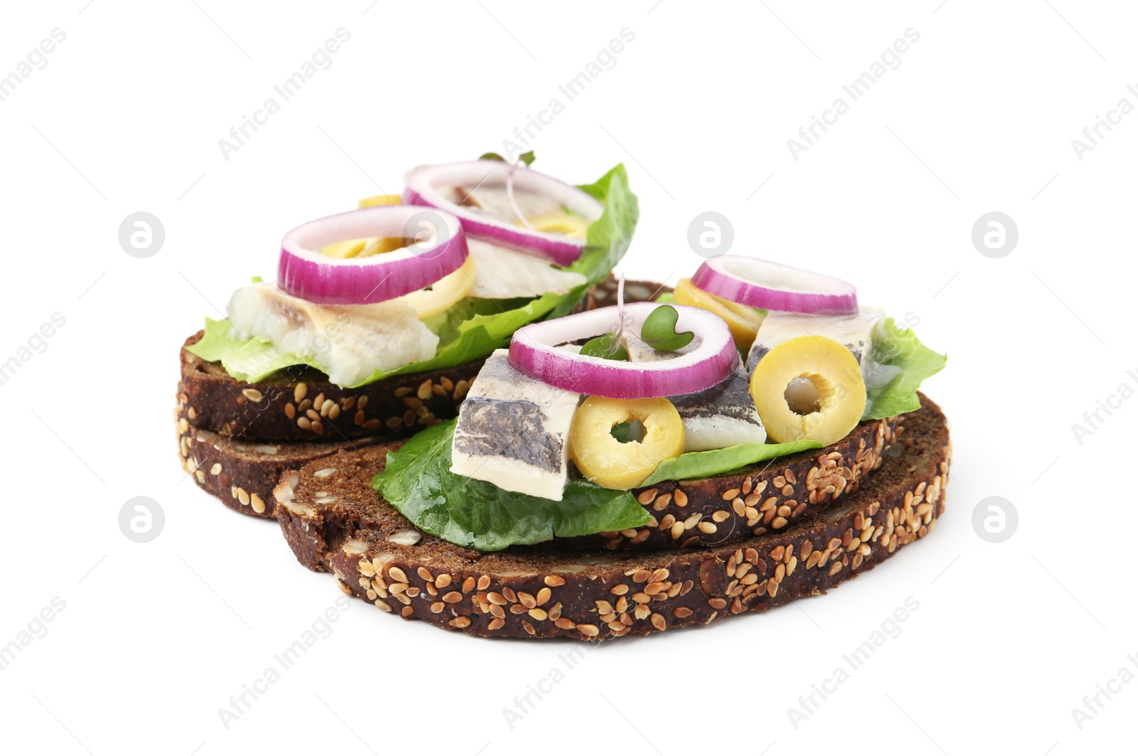 Photo of Tasty sandwiches with herring, onions, lettuce and olives isolated on white