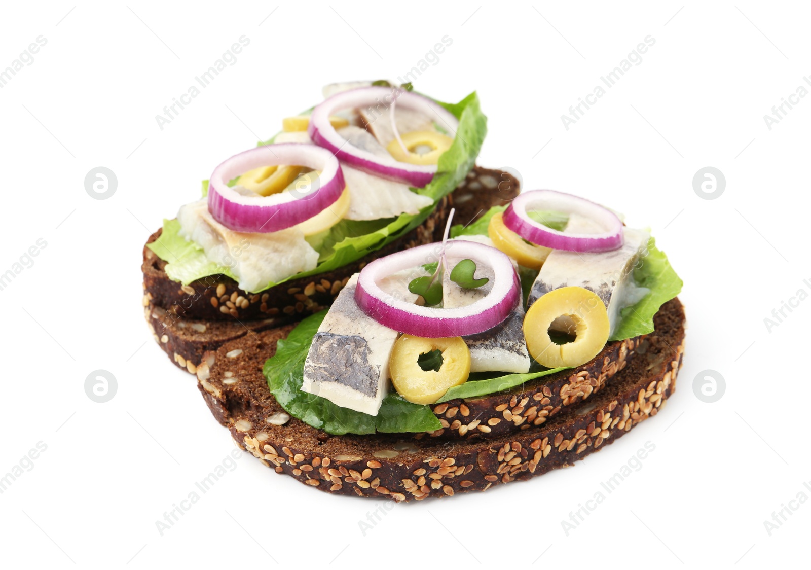 Photo of Tasty sandwiches with herring, onions, lettuce and olives isolated on white