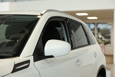 New modern white car in salon, closeup