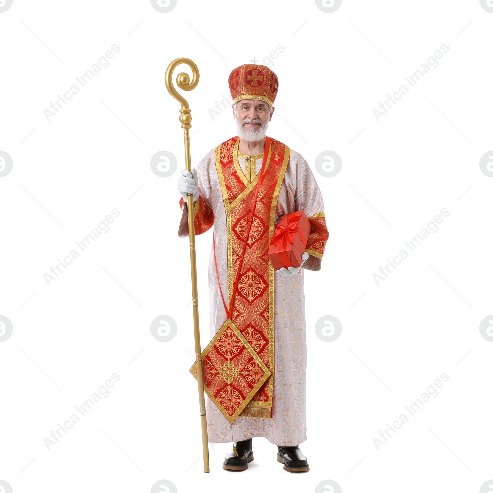 Photo of Saint Nicholas with gift on white background