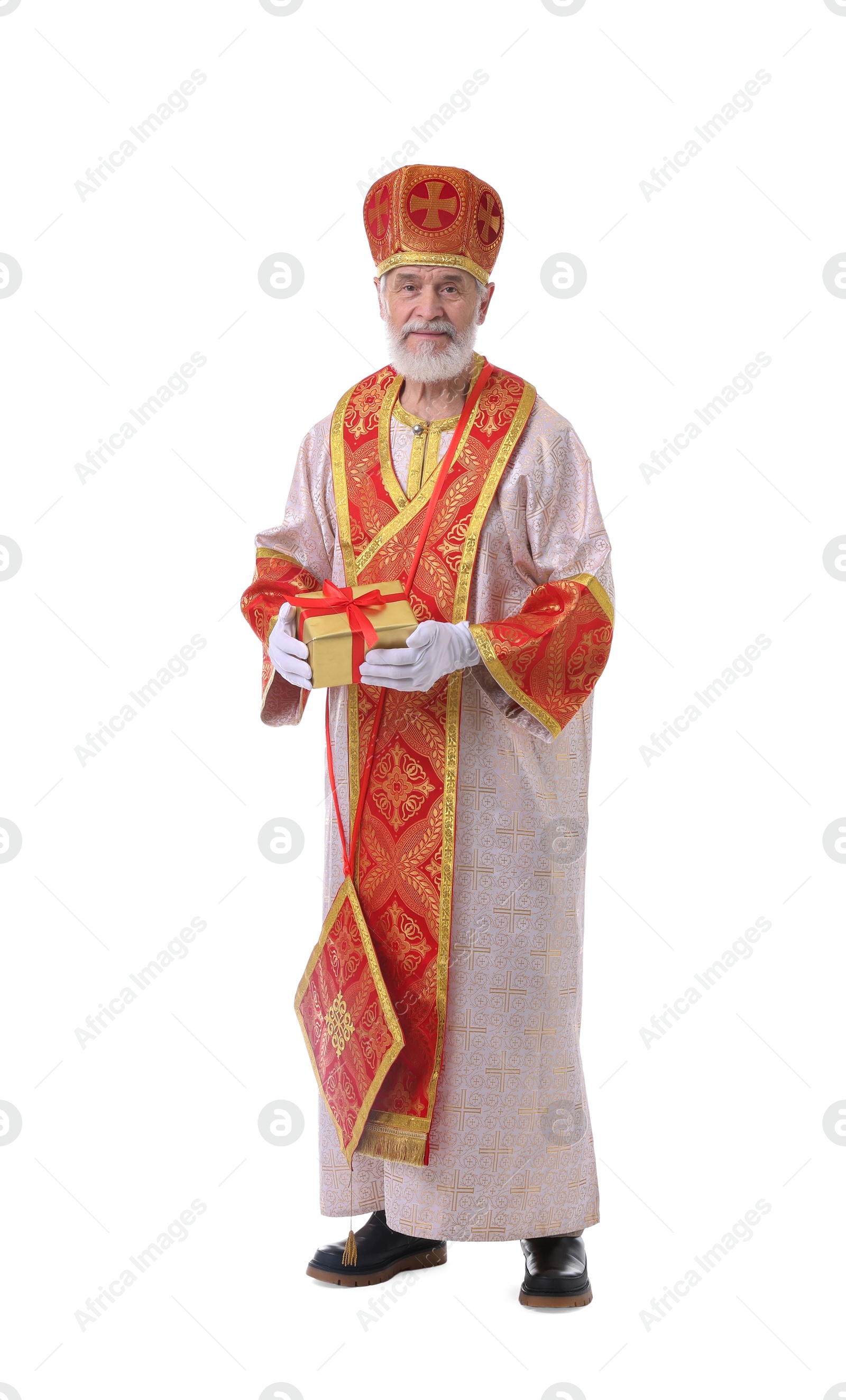 Photo of Saint Nicholas with gift on white background