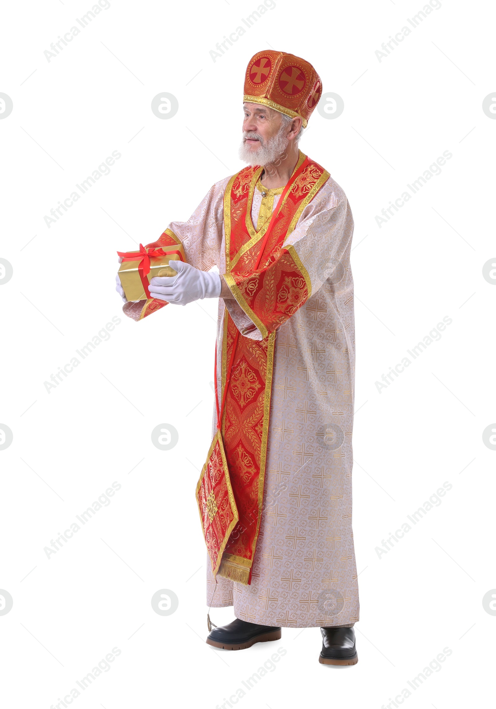 Photo of Saint Nicholas with gift on white background