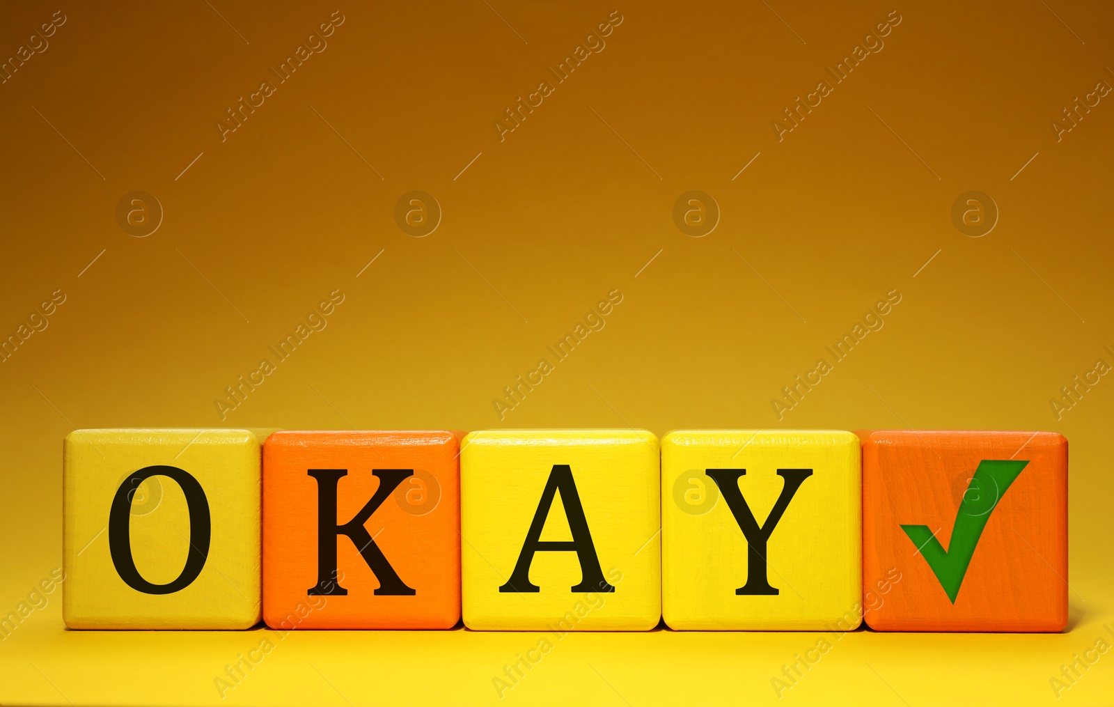 Image of Colorful cubes with word Okay and check mark on color background