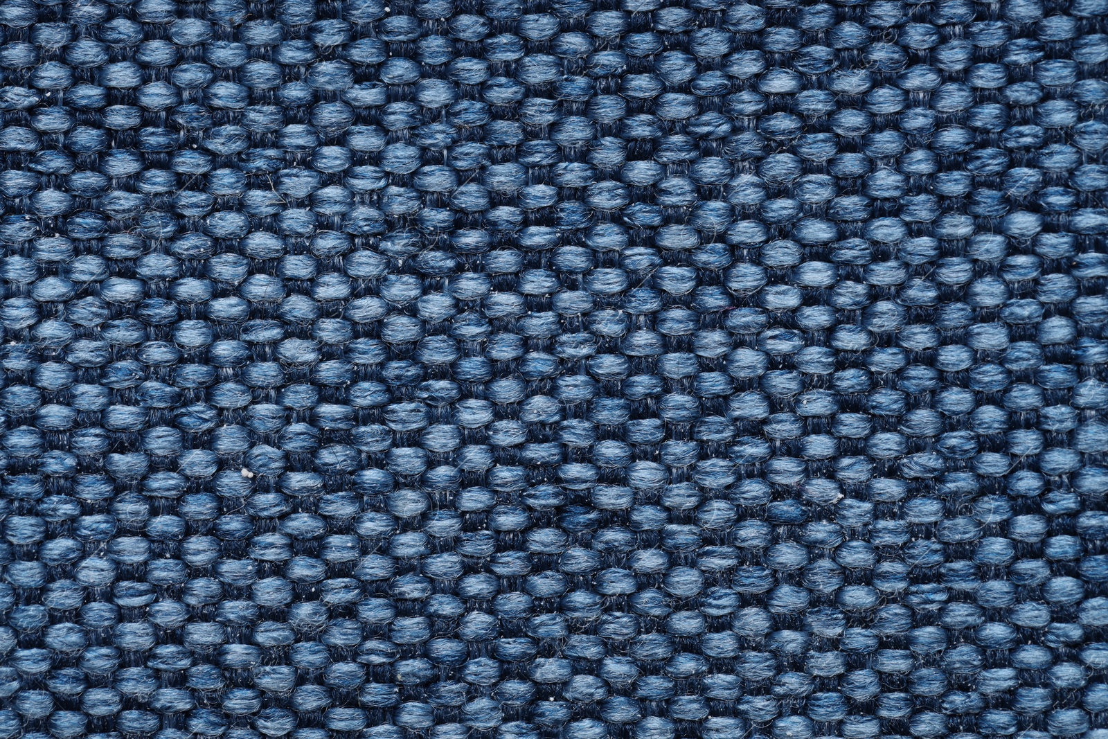 Photo of Texture of rough fabric as background, top view