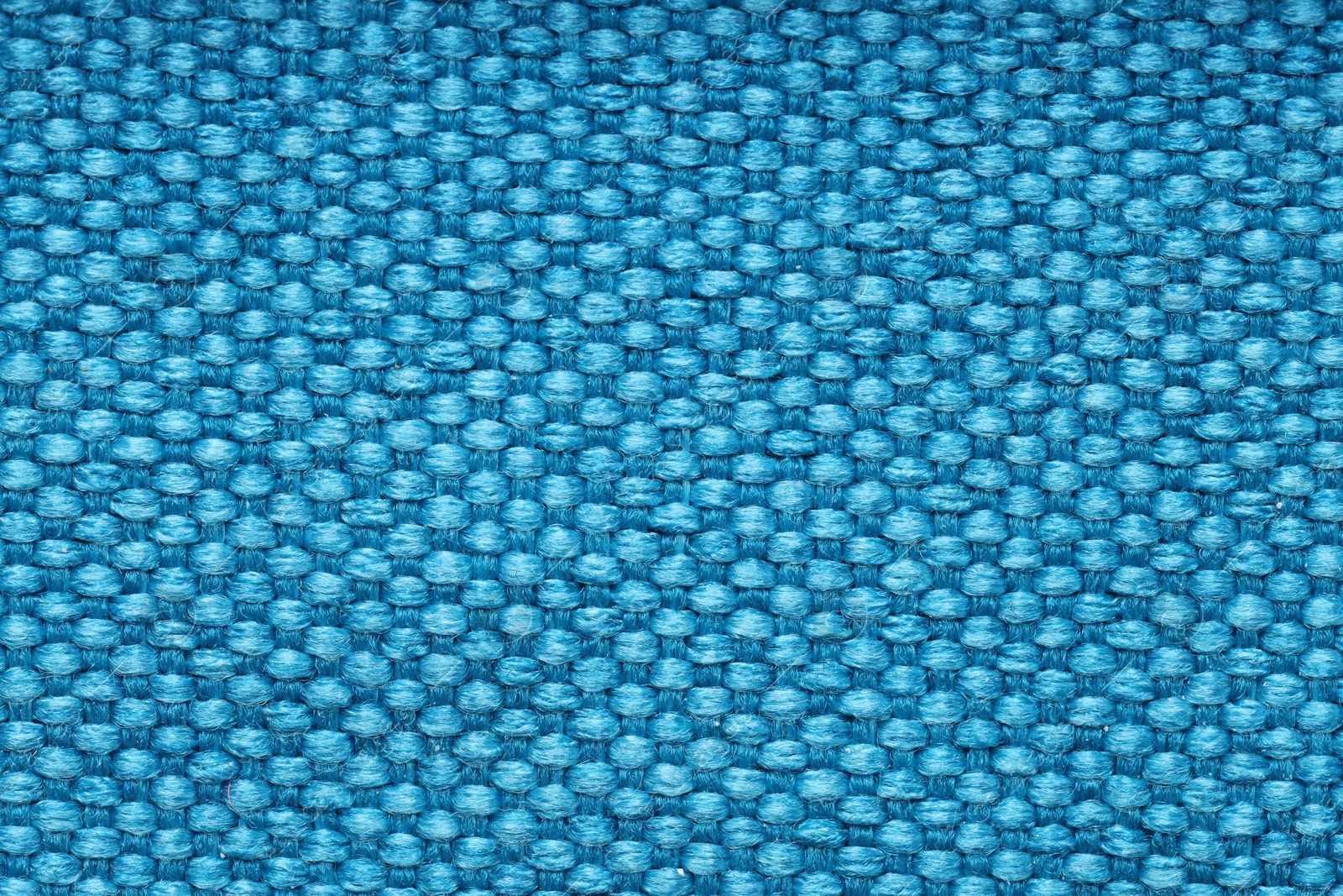 Photo of Texture of rough fabric as background, top view