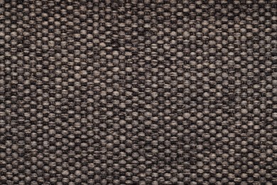 Photo of Texture of rough fabric as background, top view