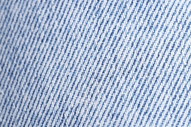 Photo of Texture of light blue woven fabric as background, closeup