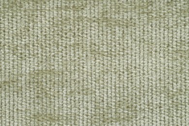 Photo of Texture of pale olive woven fabric as background, top view