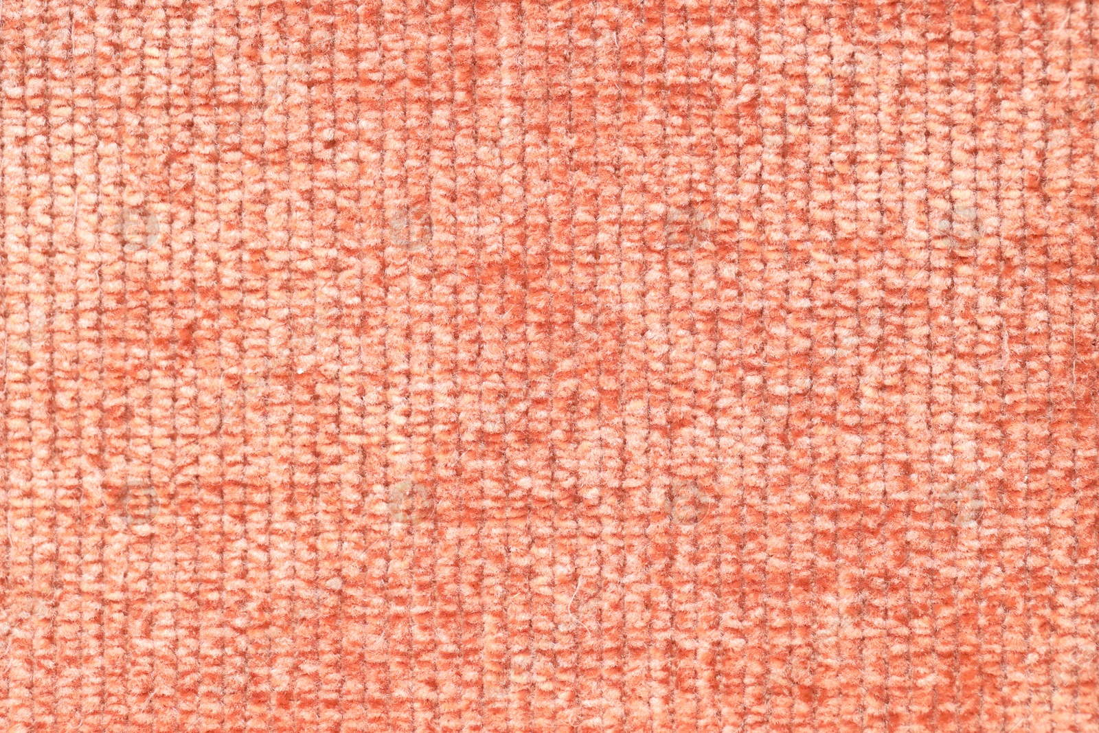 Photo of Texture of coral woven fabric as background, top view