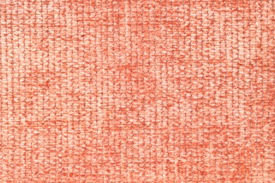 Photo of Texture of coral woven fabric as background, top view