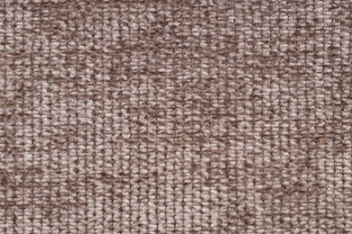 Photo of Texture of brown woven fabric as background, top view