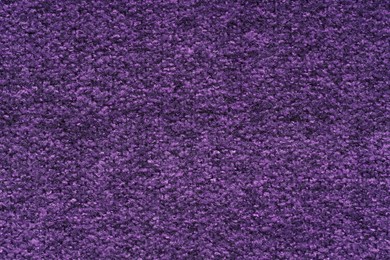 Photo of Texture of purple woven fabric as background, top view