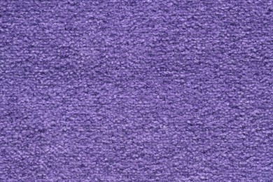 Photo of Texture of purple woven fabric as background, top view