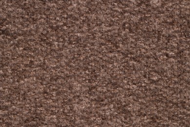 Photo of Texture of brown woven fabric as background, top view