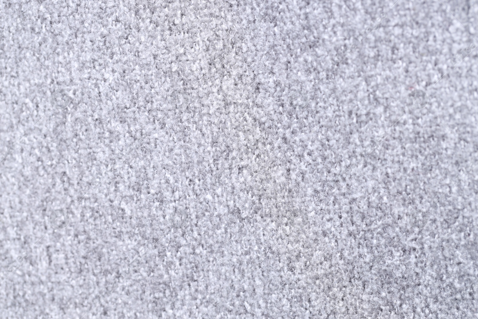 Photo of Texture of light grey woven fabric as background, closeup