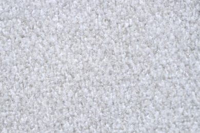 Photo of Texture of light grey woven fabric as background, closeup