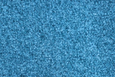 Photo of Texture of light blue woven fabric as background, closeup