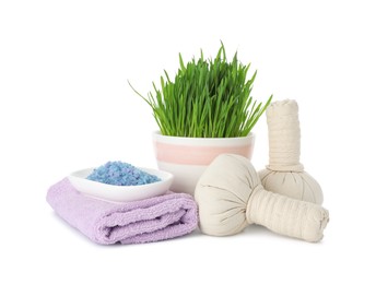 Photo of Spa composition with wheatgrass and herbal bags isolated on white