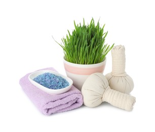 Photo of Spa composition with wheatgrass and herbal bags isolated on white