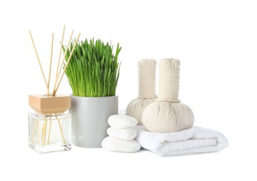 Photo of Spa composition with wheatgrass and herbal bags isolated on white