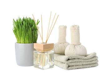 Photo of Spa composition with wheatgrass and herbal bags isolated on white