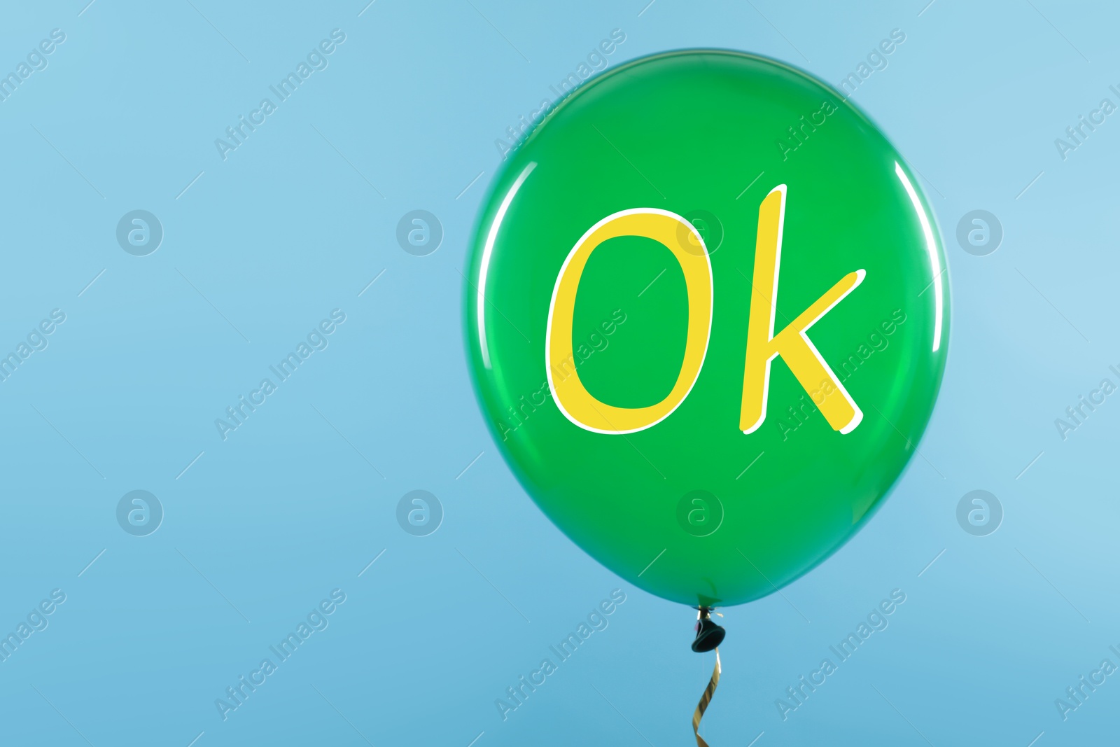 Image of Green balloon with abbreviation OK on light blue background, space for text