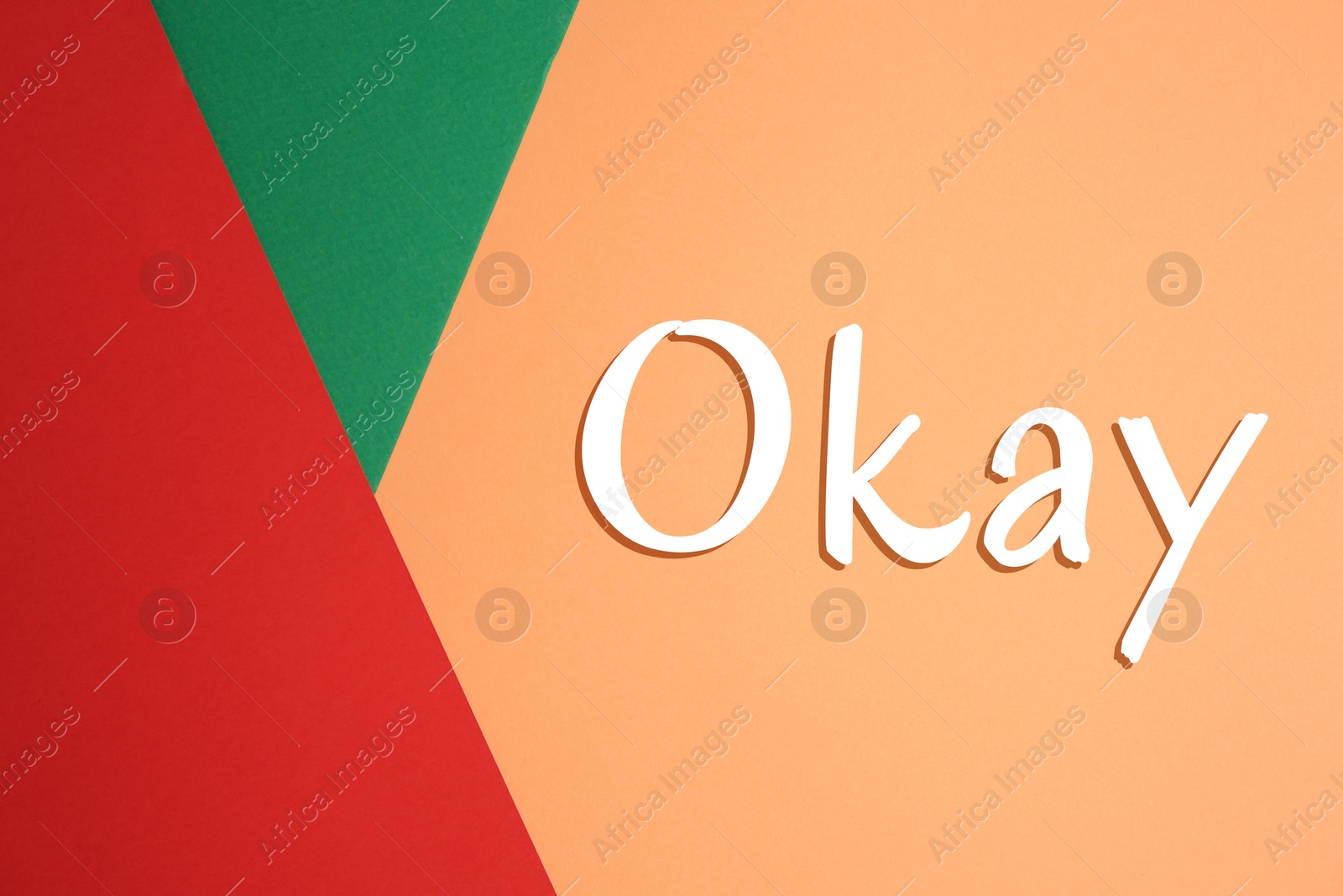 Image of Word Okay on color background, top view