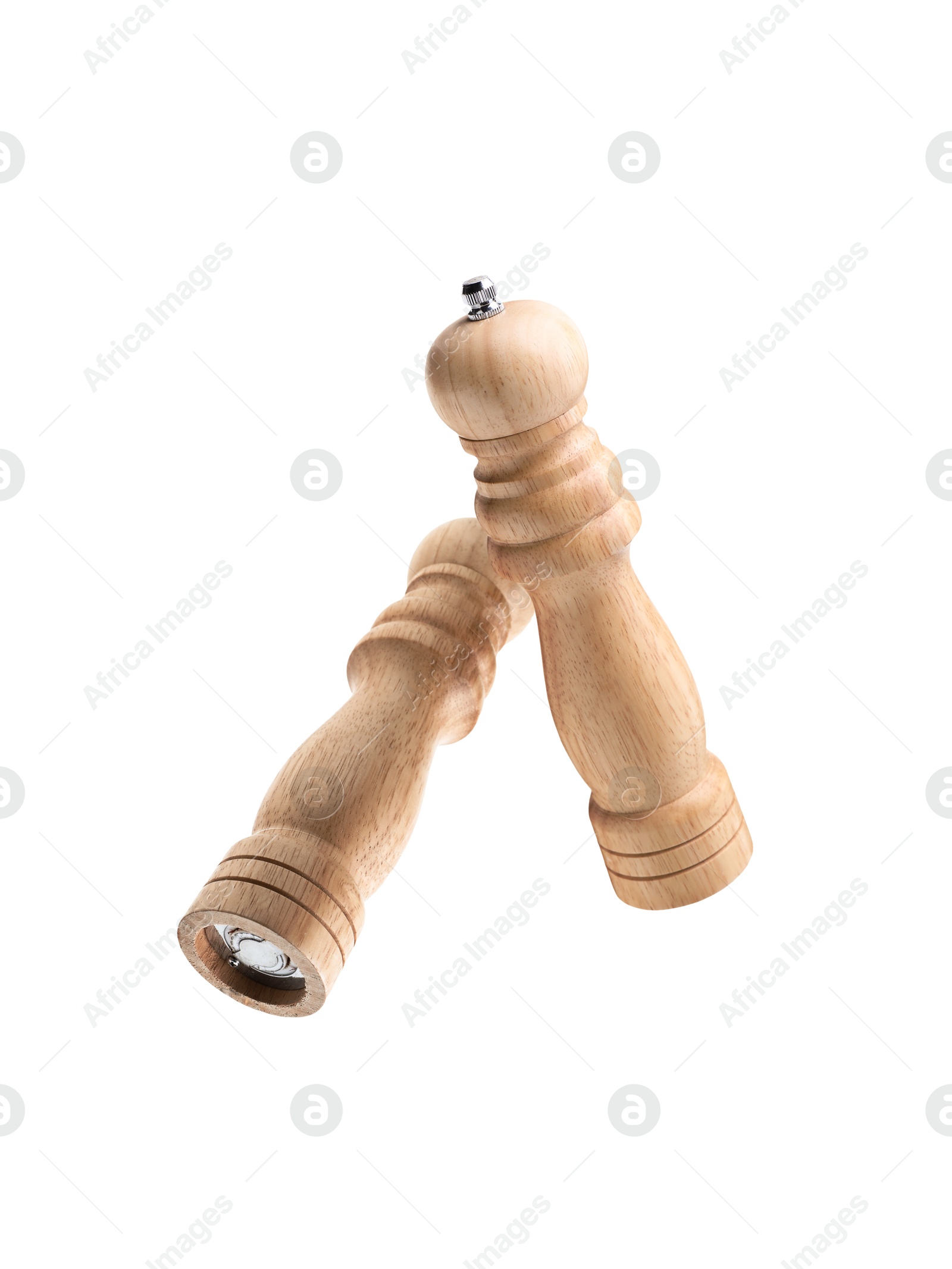 Image of Salt and pepper mills in air on white background