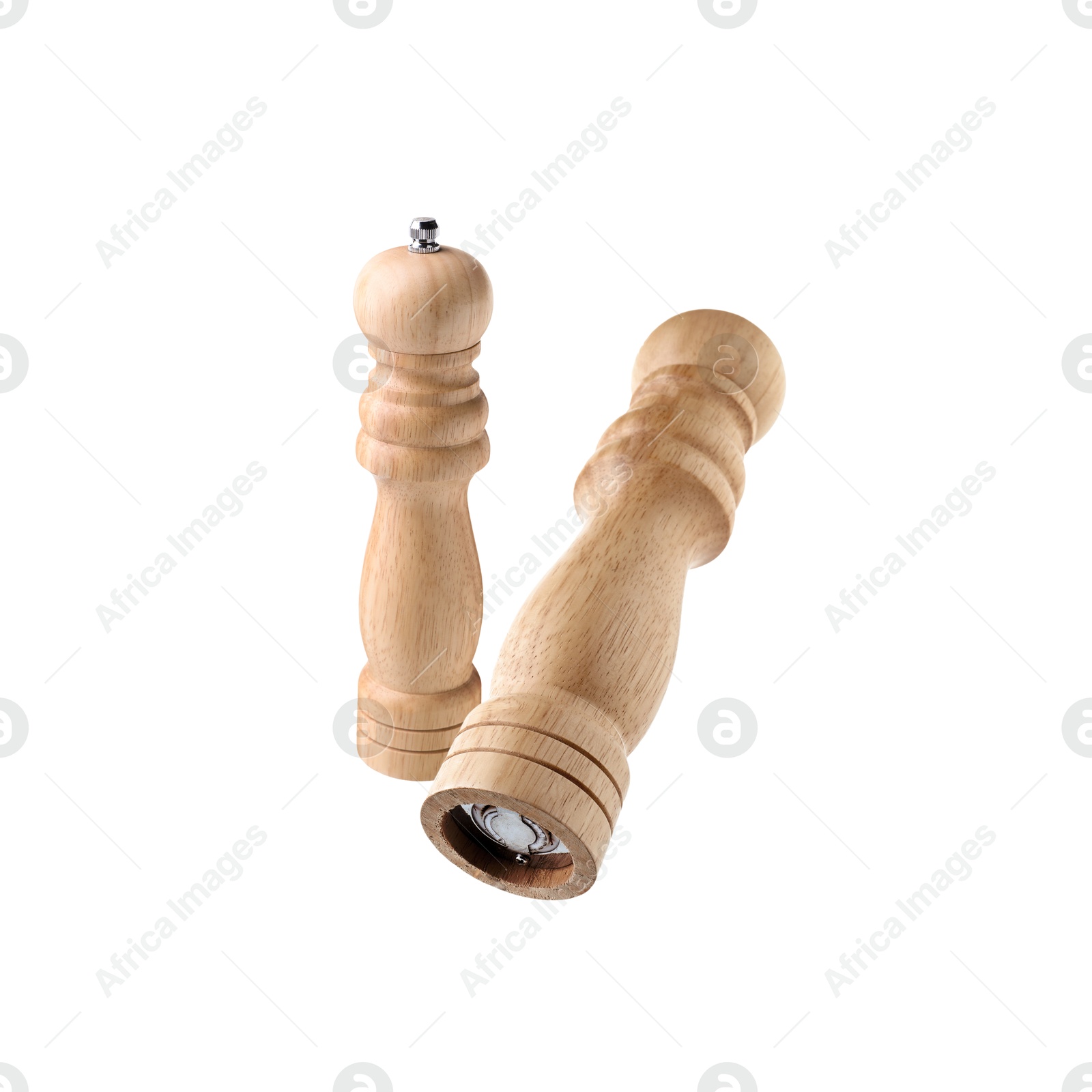 Image of Salt and pepper mills in air on white background