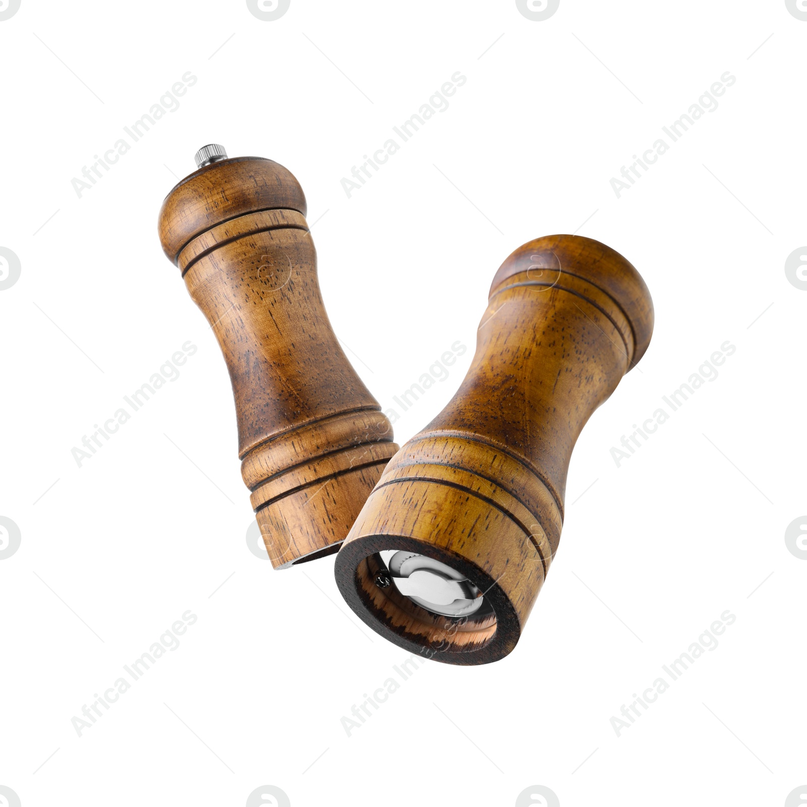 Image of Salt and pepper mills in air on white background