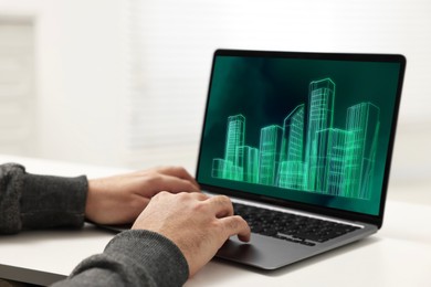 Image of Building information modeling. Man working at laptop indoors, closeup. Digital project on computer display