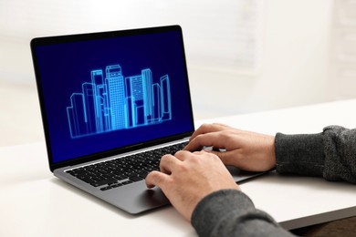 Image of Building information modeling. Man working at laptop indoors, closeup. Digital project on computer display