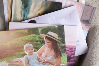 Photo of Canvas with different printed photos on armchair, top view