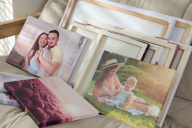 Photo of Canvas with different printed photos on sofa, closeup