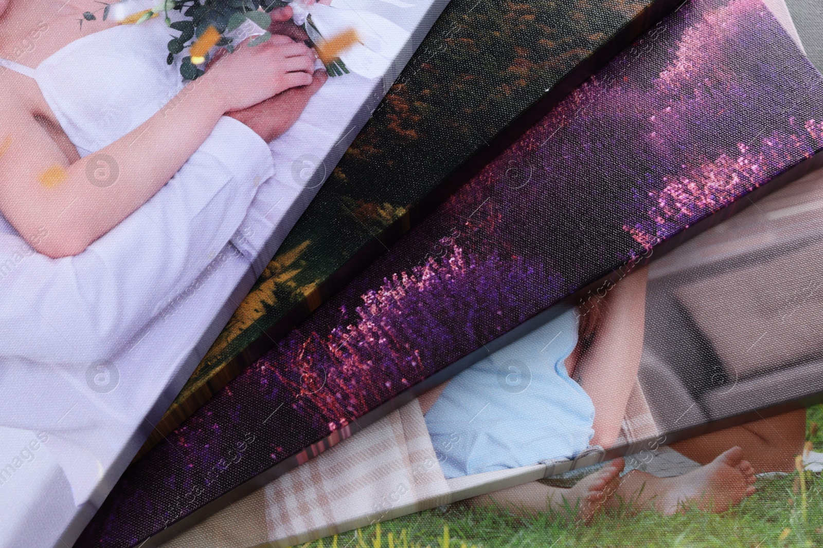 Photo of Canvas with different printed photos as background, closeup