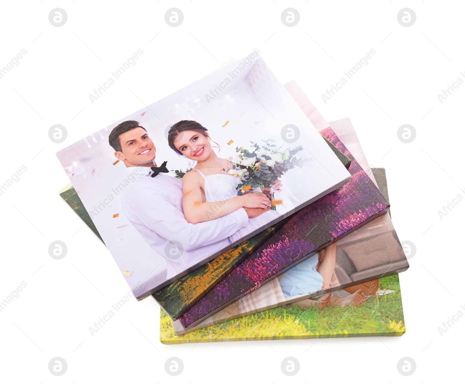 Photo of Canvas with different printed photos isolated on white, above view