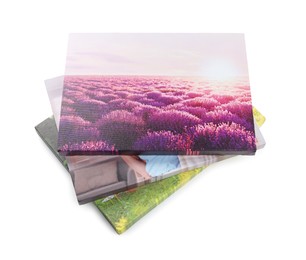 Photo of Canvas with different printed photos isolated on white, above view