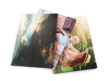 Canvas with different printed photos isolated on white, above view