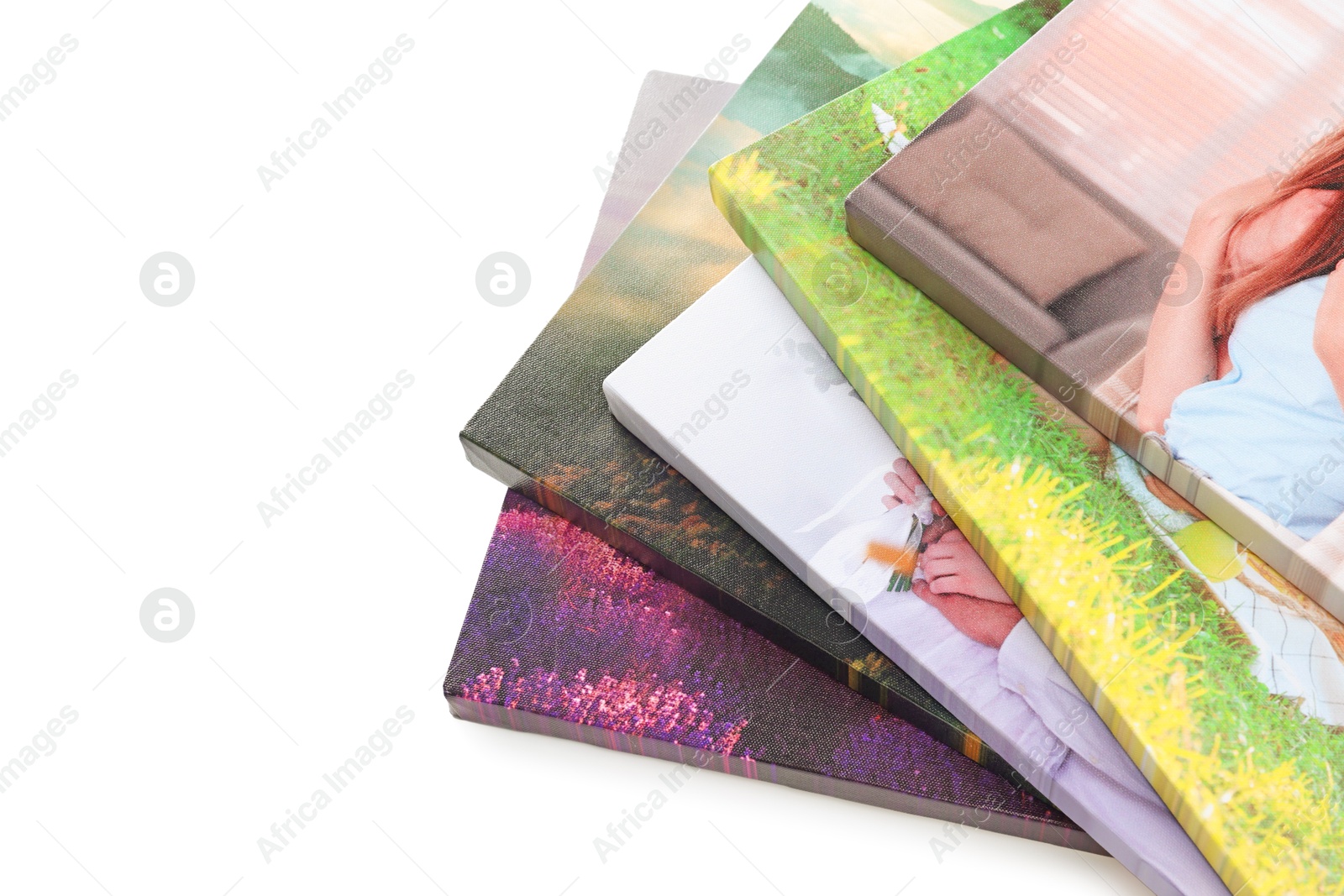 Photo of Canvas with different printed photos isolated on white