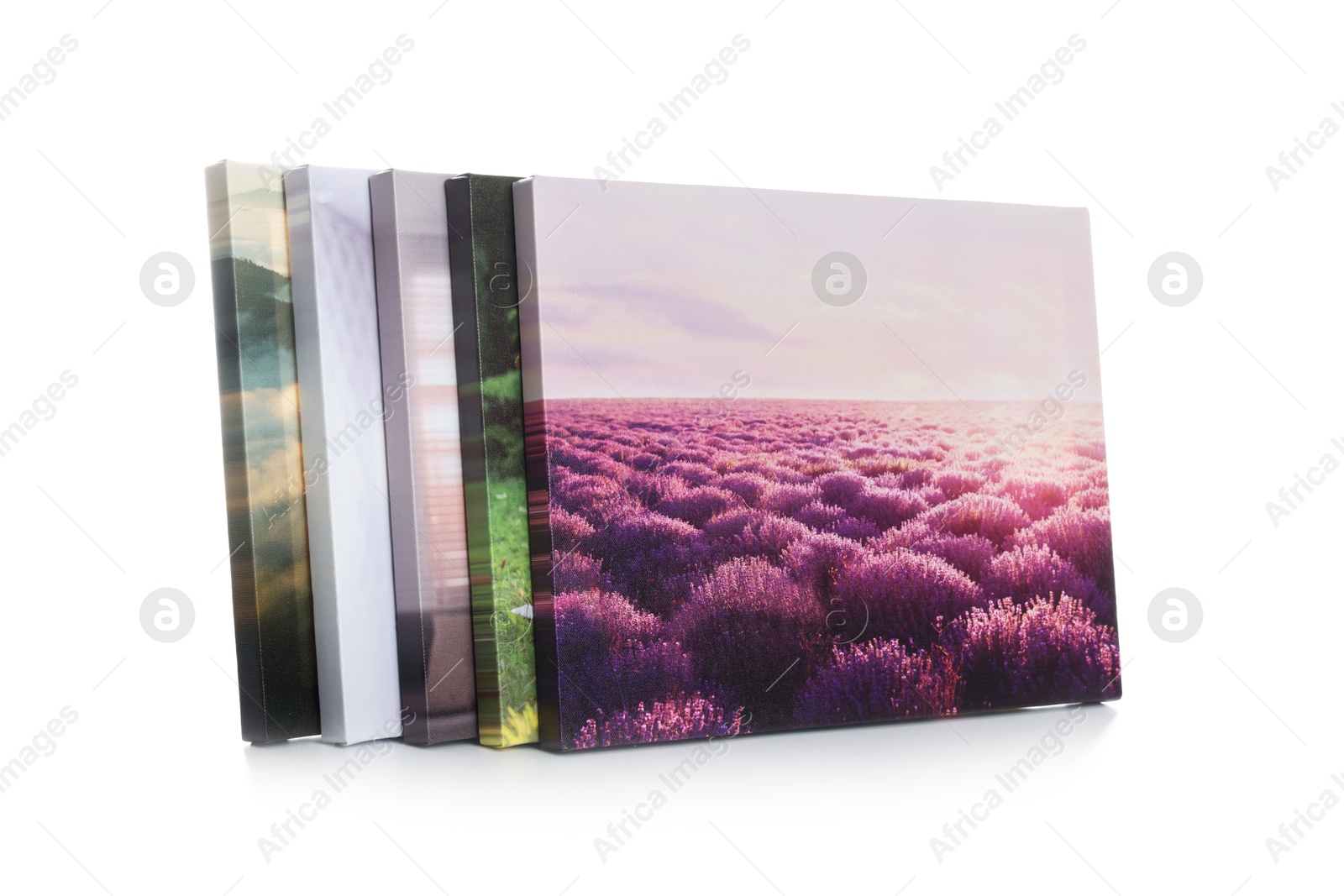 Photo of Canvas with different printed photos isolated on white