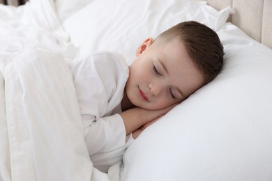 Bedtime. Cute boy sleeping in comfortable bed