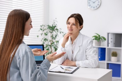 Contraception. Woman having appointment with gynecologist in clinic