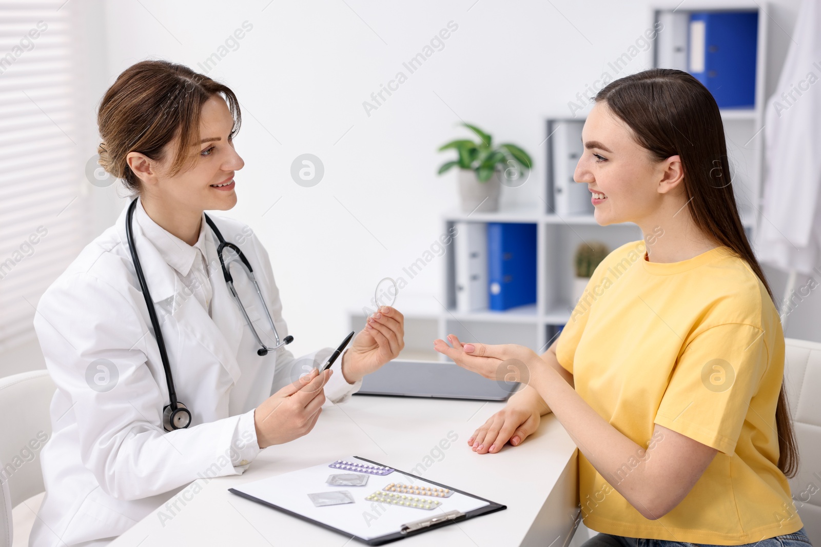 Photo of Contraception. Gynecologist recommending vaginal ring to woman in clinic